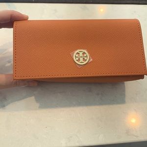Tory Burch eyeglass case. NWOT. Burnt orange with gold Tory Burch logo and snap